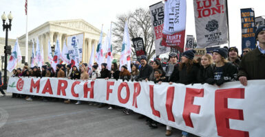 People march near the US Supreme Court during the 53rd annual March for Life rally in Washington, DC, on January 23, 2026.