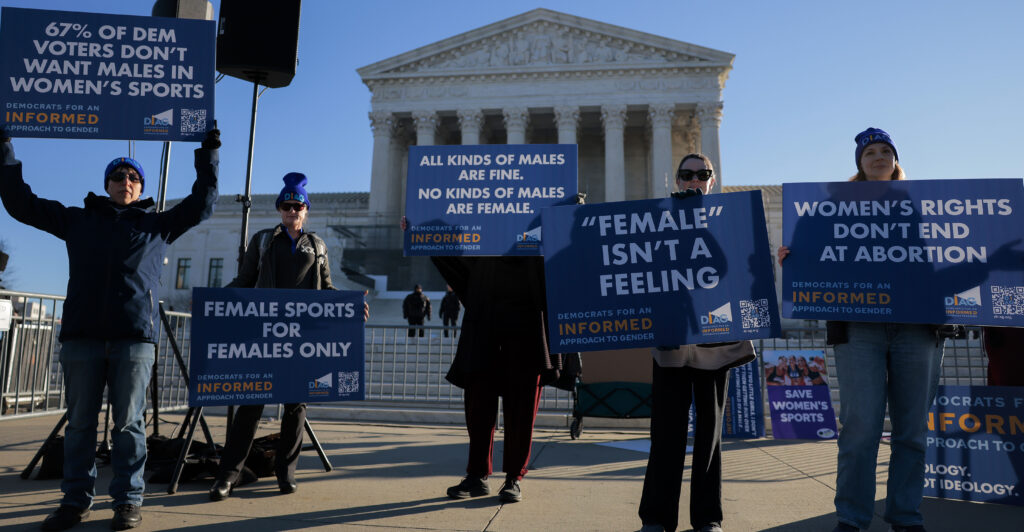 WASHINGTON, DC - JANUARY 13: Protesters who align with the Democratic Party but are against transgender athletes competing in women's sports gather outside the Supreme Court on January 13, 2026 in Washington, DC. Groups from both sides of the debate gathered on Tuesday morning to protest while two cases that prohibit transgender girls from joining girls' and women's sports teams are heard inside the Supreme Court. (Photo by Heather Diehl/Getty Images)
