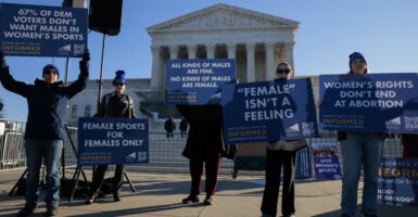 WASHINGTON, DC - JANUARY 13: Protesters who align with the Democratic Party but are against transgender athletes competing in women's sports gather outside the Supreme Court on January 13, 2026 in Washington, DC. Groups from both sides of the debate gathered on Tuesday morning to protest while two cases that prohibit transgender girls from joining girls' and women's sports teams are heard inside the Supreme Court. (Photo by Heather Diehl/Getty Images)