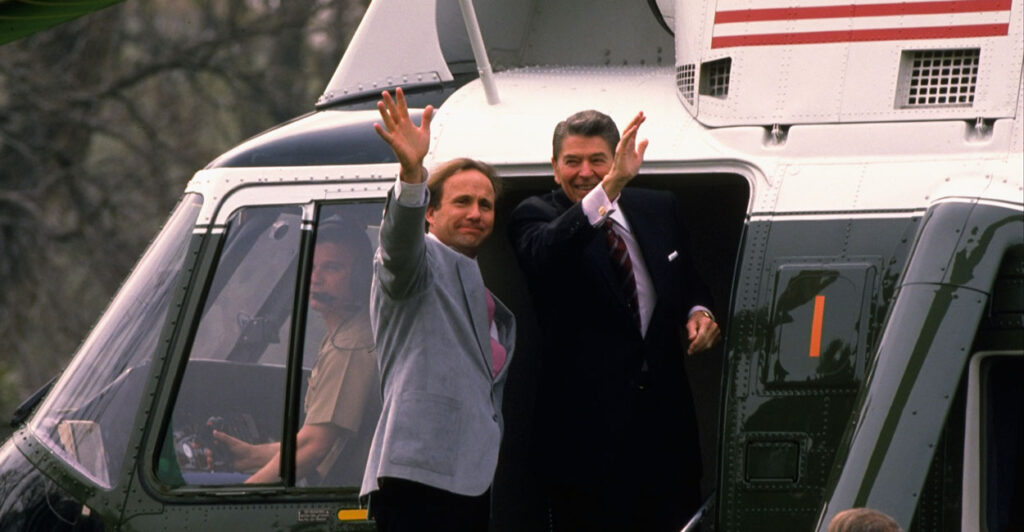 President Ronald Reagan with son Michael Reagan in doorway of Marine One, departing for CA.
