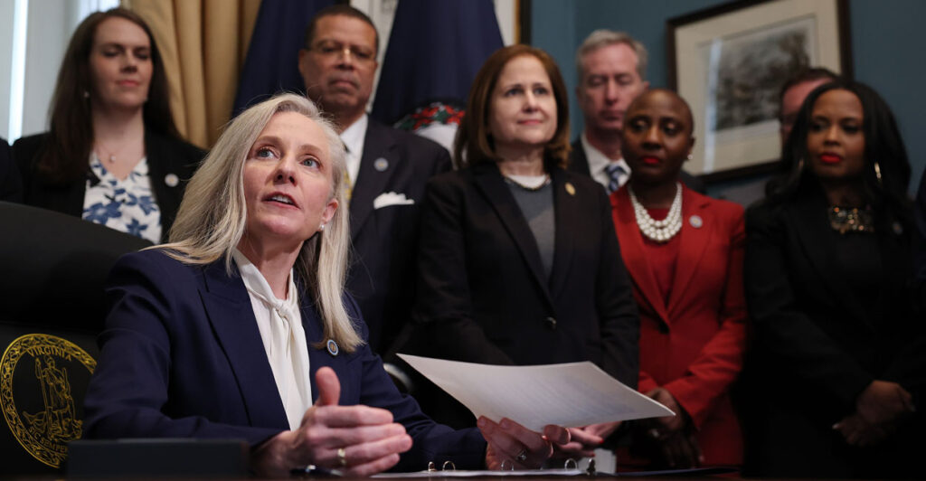 Virginia Governor Abigail Spanberger signs executive orders after being sworn into office at the Virginia State Capitol January 17, 2026 in Richmond, Virginia.