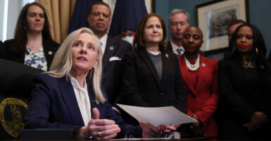 Virginia Governor Abigail Spanberger signs executive orders after being sworn into office at the Virginia State Capitol January 17, 2026 in Richmond, Virginia.