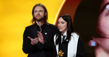 LOS ANGELES, CALIFORNIA - FEBRUARY 01: FINNEAS and Billie Eilish accept the Song of the Year award for "WILDFLOWER" onstage during the 68th GRAMMY Awards at Crypto.com Arena on February 01, 2026 in Los Angeles, California. (Photo by Kevin Mazur/Getty Images for The Recording Academy)