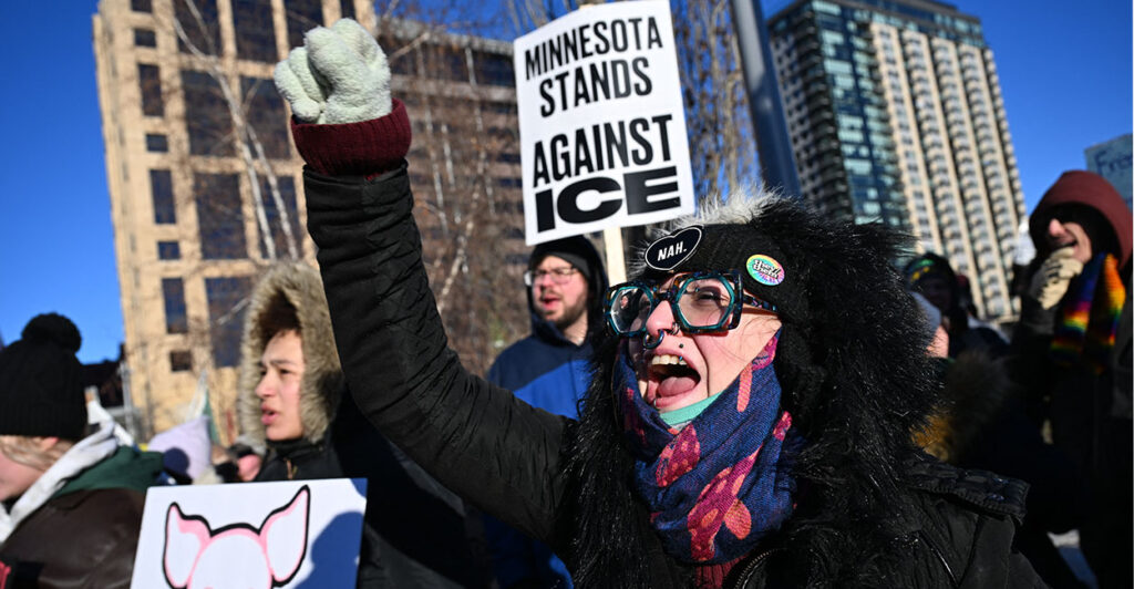 A woman yells during a march against US Immigration and Customs Enforcement (ICE) in Minneapolis, Minnesota, on January 30, 2026. Donald Trump's border chief said January 29, 2026 that some federal agents could be withdrawn from Minneapolis, the northern US city that has become the flashpoint for the president's immigration crackdown. The Trump administration, facing a public backlash over the shooting deaths of two Americans by federal agents in Minneapolis, also eased immigration operations in the northeastern state of Maine. (Photo by ROBERTO SCHMIDT / AFP via Getty Images)