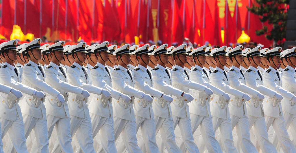 Chinese People's Liberation Army (PLA) naval officers march pass Tiananmen Square during the National Day parade in Beijing on October 1, 2009. China formally kicked off mass celebrations of 60 years of communist rule with a 60-gun salute that rung out across Beijing's historic Tiananmen Square. AFP PHOTO/FREDERIC J. BROWN (Photo credit should read FREDERIC J. BROWN/AFP via Getty Images)