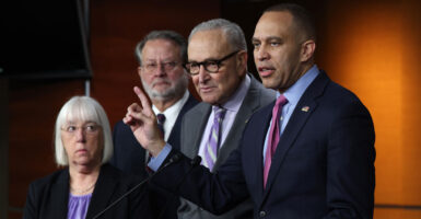 Hakeem Jeffries points while addressing reporters alongside Sen. Chuck Schumer, Sen. Gary Peters, and Sen. Patty Murray.