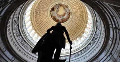 A statue of the first President of the US, George Washington, stands at the US Capitol in Washington, DC, on April 6, 2011. (Jewel Samad/AFP via Getty Images)