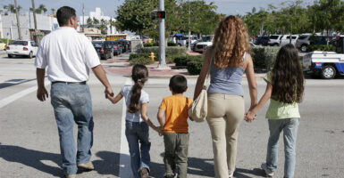 Family Crossing Street. (Photo by: Jeff Greenberg/Universal Images Group via Getty Images)