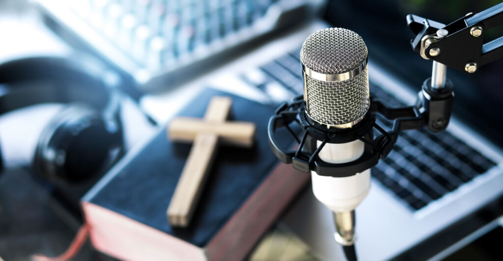 Christian podcast, preacher the bible online, records a podcast, online radio broadcast. - stock photo