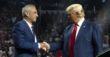 GLENDALE, ARIZONA - AUGUST 23: Former Republican presidential candidate Robert F. Kennedy Jr. and Republican presidential nominee, former U.S. President Donald Trump shake hands during a campaign rally at Desert Diamond Arena on August 23, 2024 in Glendale, Arizona. Kennedy announced today that he was suspending his presidential campaign and supporting former President Trump. (Photo by Rebecca Noble/Getty Images)