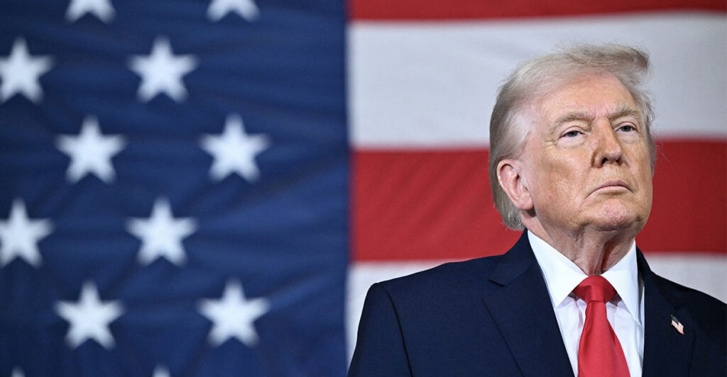 TOPSHOT - US President Donald Trump looks on during an event with members of the military and their families at Fort Bragg, North Carolina on February 13, 2026. Trump will meet on Friday with the special forces soldiers who captured Venezuelan leader Nicolas Maduro in a deadly raid in Caracas in January. (Photo by Mandel NGAN / AFP via Getty Images)