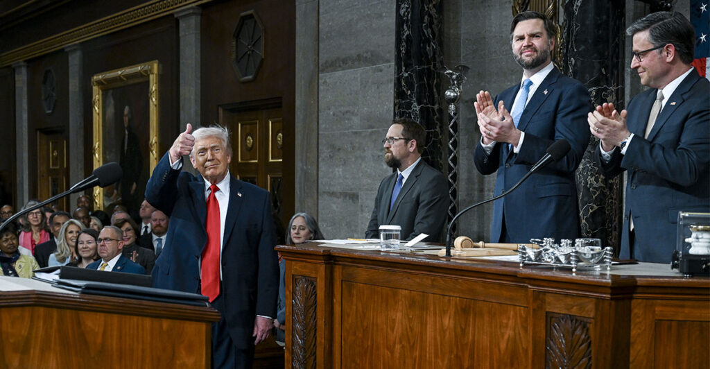 WASHINGTON, DC - FEBRUARY 24: U.S. President Donald Trump arrives to deliver the State of the Union address during a joint session of Congress in the House Chamber at the Capitol on February 24, 2026 in Washington, DC. Seated behind him are Vice President JD Vance and House Speaker Mike Johnson (R-LA). Trump delivered his address days after the Supreme Court struck down the administration's tariff strategy, and amid a U.S. military buildup in the Persian Gulf threatening Iran. (Photo by Kenny Holston-Pool/Getty Images)