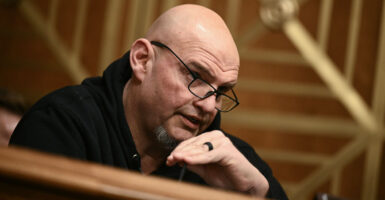 Close-up of John Fetterman speaking during a hearing.