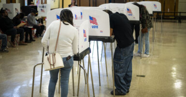 BELTSVILLE, MD - NOVEMBER 5: Voting booths and voters are seen at a polling location at Beltsville Academy on Election Day, Tuesday, November 5, 2024, in Beltsville, Maryland. (Photo by Graeme Sloan for The Washington Post via Getty Images)