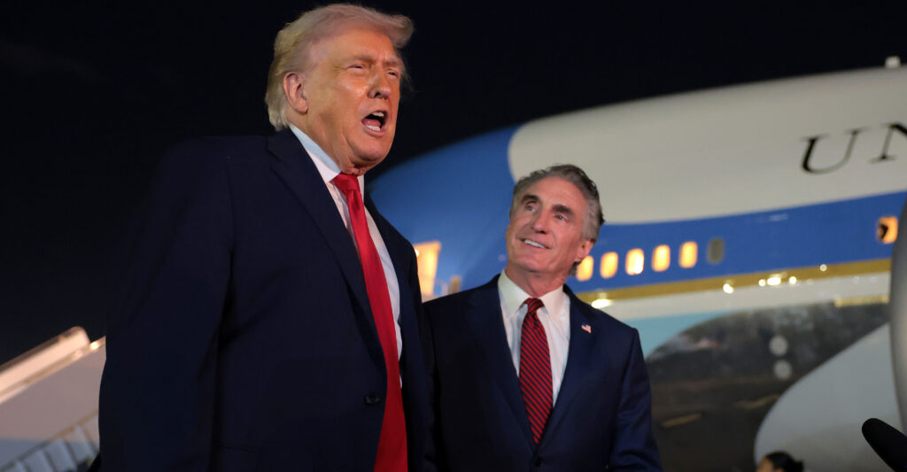 WEST PALM BEACH, FLORIDA - JANUARY 19: U.S. President Donald Trump (L) talks with reporters as U.S. Secretary of the Interior Doug Burgum (R) looks on at Palm Beach International Airport on January 19, 2026 in West Palm Beach, Florida. President Trump attended this year’s college football national championship game at Hard Rock Stadium between the Indiana Hoosiers and the Miami Hurricanes. (Photo by Anna Moneymaker/Getty Images)