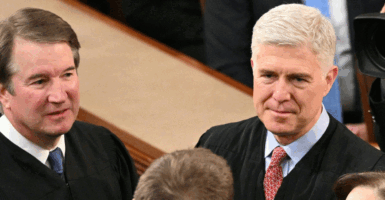 US Supreme Court Associate Justices Neil Gorsuch (R) and Brett Kavanaugh (L) arrive for US President Joe Biden's State of the Union address in the House Chamber of the US Capitol in Washington, DC, on March 7, 2024. (Photo by Mandel NGAN / AFP) (Photo by MANDEL NGAN/AFP via Getty Images)