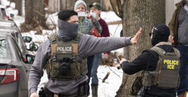 MINNEAPOLIS, MINNESOTA - FEBRUARY 05: Observers film ICE agents as they hold a perimeter after one of their vehicles got a flat tire on Penn Avenue on February 5, 2026 in Minneapolis, Minnesota. Protests continue calling for an end to immigration raids in the Twin cities which have already resulted in the fatal shooting deaths of Alex Pretti, a VA nurse, and Renee Good, a mother of three, by federal agents. (Photo by Stephen Maturen/Getty Images)