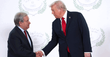 OCTOBER 13: U.S. President Donald Trump and United Nations (UN) Secretary-General Antonio Guterres shake hands as they pose for a photo during a world leaders' summit on ending the Gaza war on October 13, 2025 in Sharm El-Sheikh, Egypt. President Trump is in Egypt to meet with European and Middle Eastern leaders in what’s being billed as an international peace summit, following the start of a US-brokered ceasefire deal to end the war in the Gaza Strip. (Photo by Suzanne Plunkett - Pool / Getty Images)
