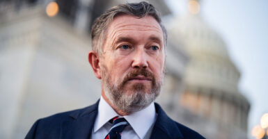 Thomas Massie speaks to reporters outside the Capitol.