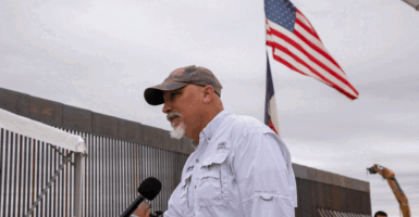 Chip Roy speaks to a a reporter following a news conference to commemorate state-sponsored border wall construction.