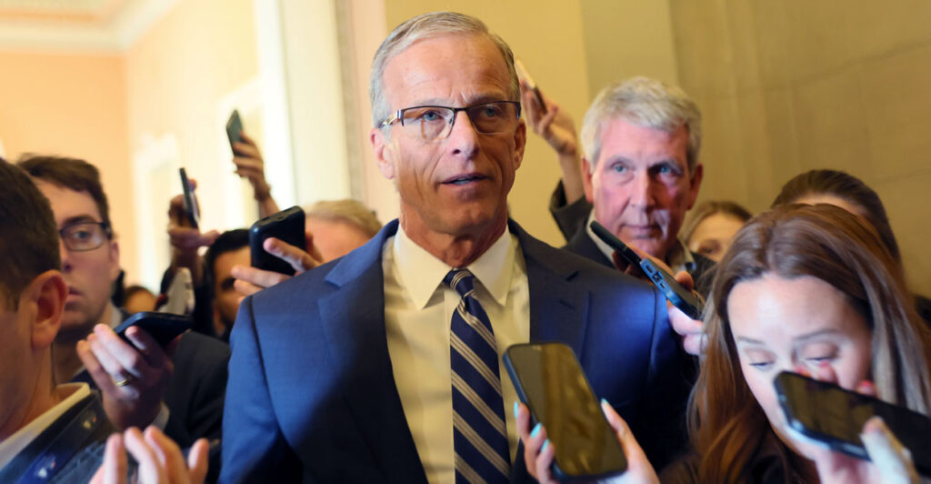 Senate Majority Leader John Thune speaks to reporters in the capitol.