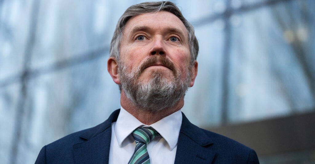 Thomas Massie speaks to reporters at Department of Justice building.