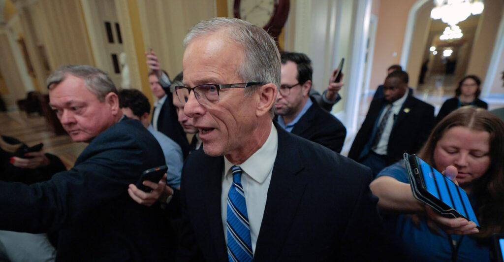 Senate Majority Leader John Thune (R-SD) is surrounded by reporters as he walks from his office to the Senate Chamber at the U.S. Capitol on February 09, 2026