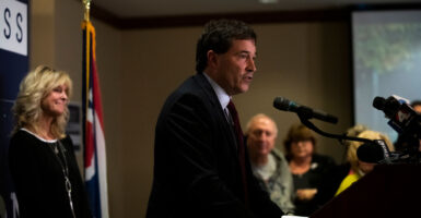 Rep. Troy Balderson speaks before a crowd at a podium.