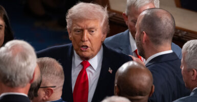 President Donald Trump greets congressmen at the State of the Union Address.