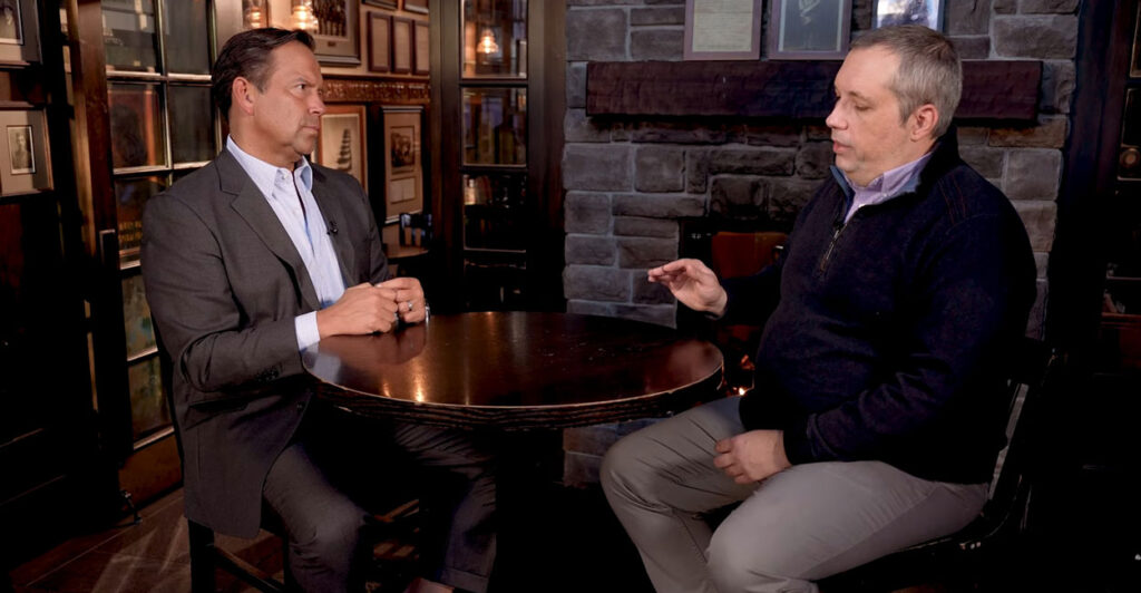 Steve Cortes sits on the left as Dr. Stephen Kleinschmit is interviewed on the right during a segment from the documentary “The Foreign Student Crisis Destroying American College Admissions.”