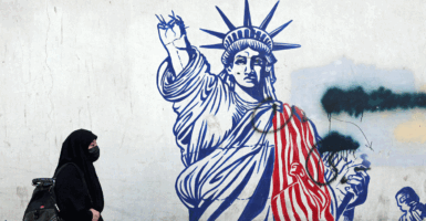 An anti-US mural next to former US embassy in Tehran.