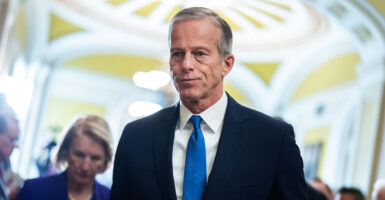 Senate Majority Leader John Thune walks through the United States Capitol.