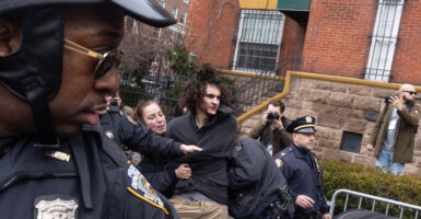NYPD arresting terror suspect Emir Balat.