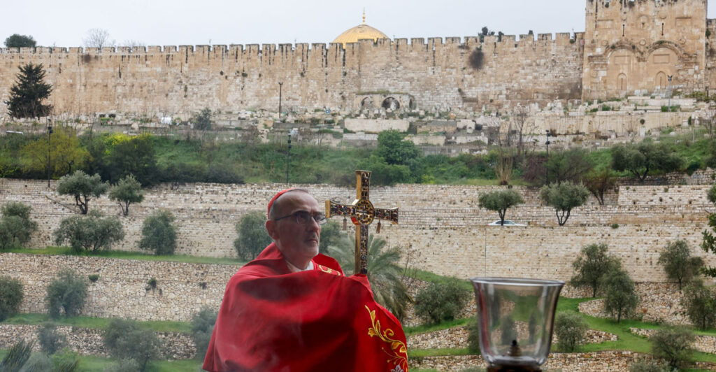 Latin Patriarch of Jerusalem, Cardinal Pierbattista Pizzaballa, leads a prayer service with Old City of Jerusalem as backdrop to mark Palm Sunday on March 29, 2026.