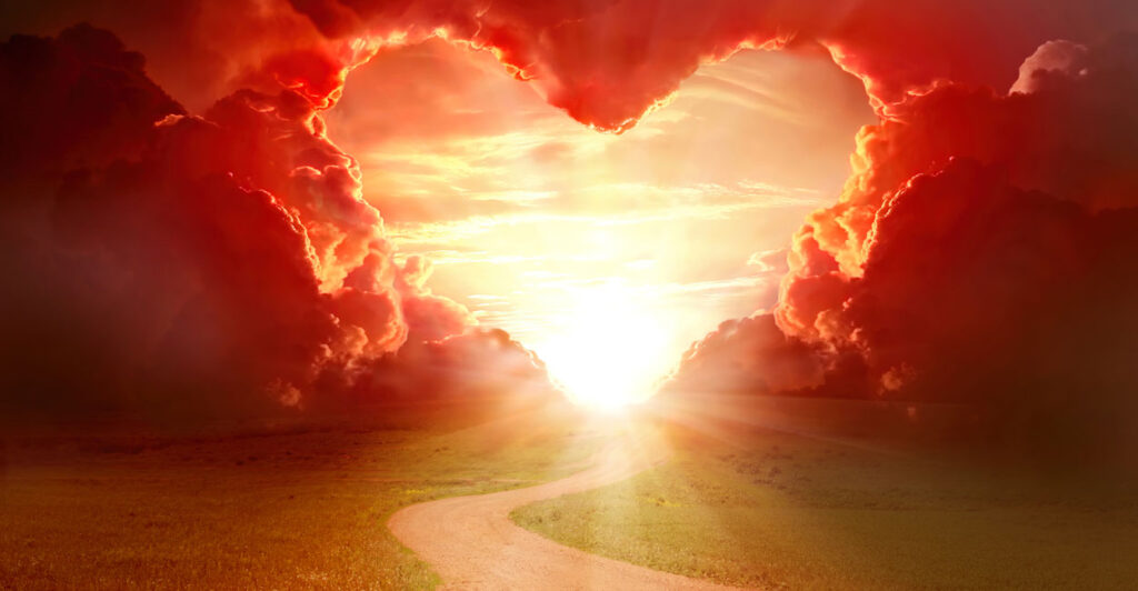 A graphic showing a country road leading toward a sunset with red clouds shaped into a heart.