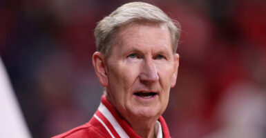 OSU President Ted Carter wears a red jacket.
