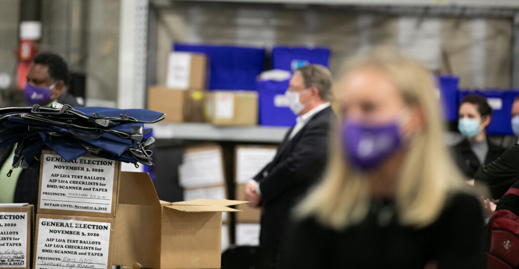 ATLANTA, GA - NOVEMBER 04: Members of an adjudication review panel look over scanned absentee ballots at the Fulton County Election Preparation Center on November 4, 2020 in Atlanta, Georgia. The 2020 presidential race between incumbent U.S. President Donald Trump and Democratic nominee Joe Biden is still too close to call with outstanding ballots to count. (Photo by Jessica McGowan/Getty Images)