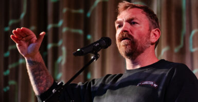 Graham Platner speaks at a rally in Maine.