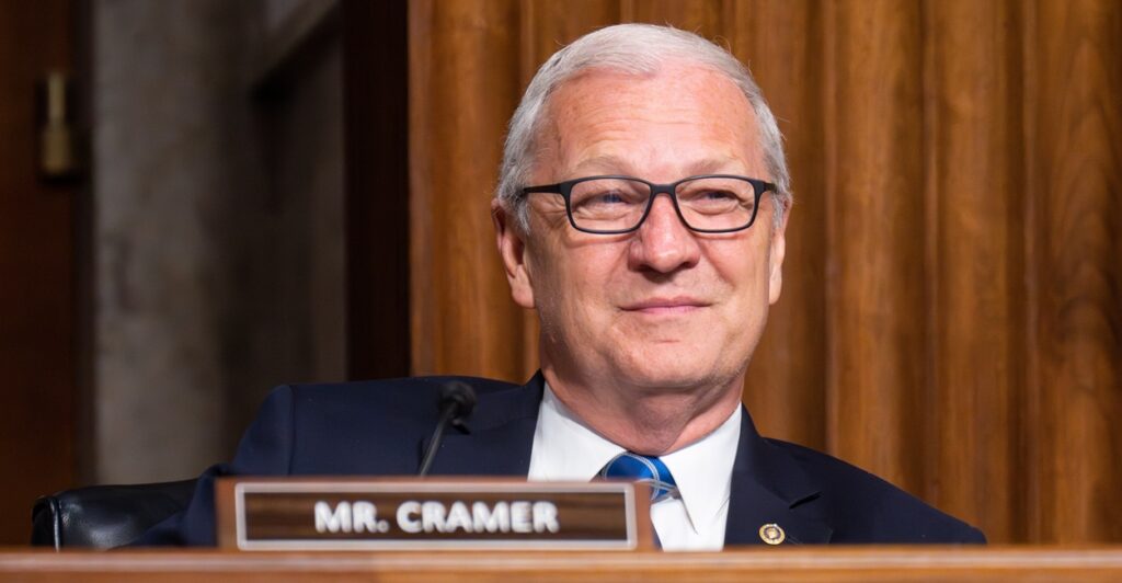 Sen. Kevin Cramer seated.
