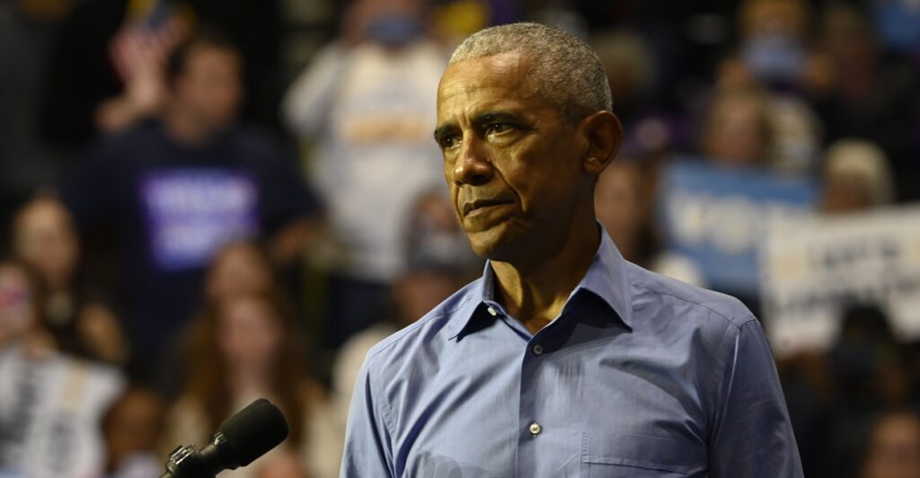 Former President Barack Obama in front of a crowd.