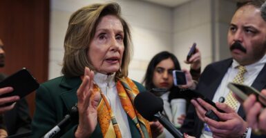 Nancy Pelosi talking with reporters.