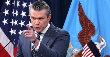 Secretary of War Pete Hegseth pointing