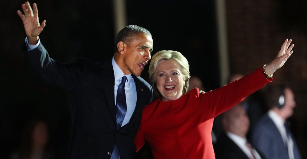 Barack Obama and Hillary Clinton waving