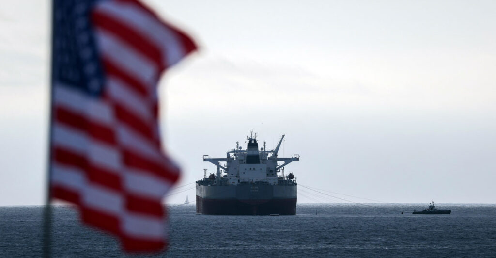 A US flag and a CHIOS crude oil tanker sits anchored off the coast of the Chevron's El Segundo Refinery in El Segundo, California on March 4, 2026.