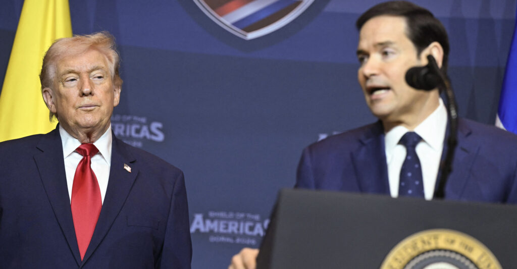 US President Donald Trump looks on as Secretary of State Marco Rubio (R) speaks during the "Shield of the Americas" Summit at Trump National Doral in Miami, Florida, March 7, 2026. (Photo by SAUL LOEB / AFP via Getty Images)