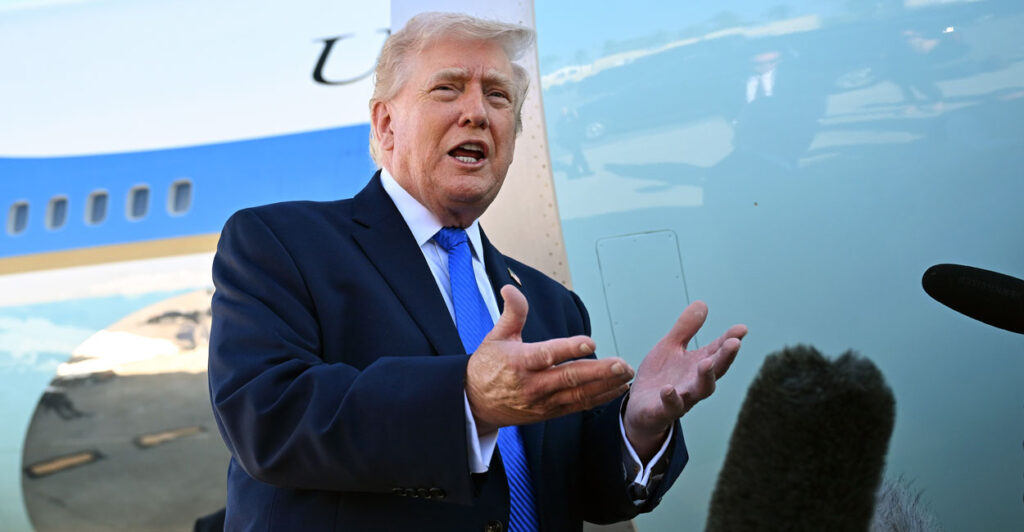 President Donald Trump speaks to reporters in front of Air Force One.