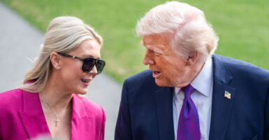 President Dondald Trump speaks to Karoline Leavitt.