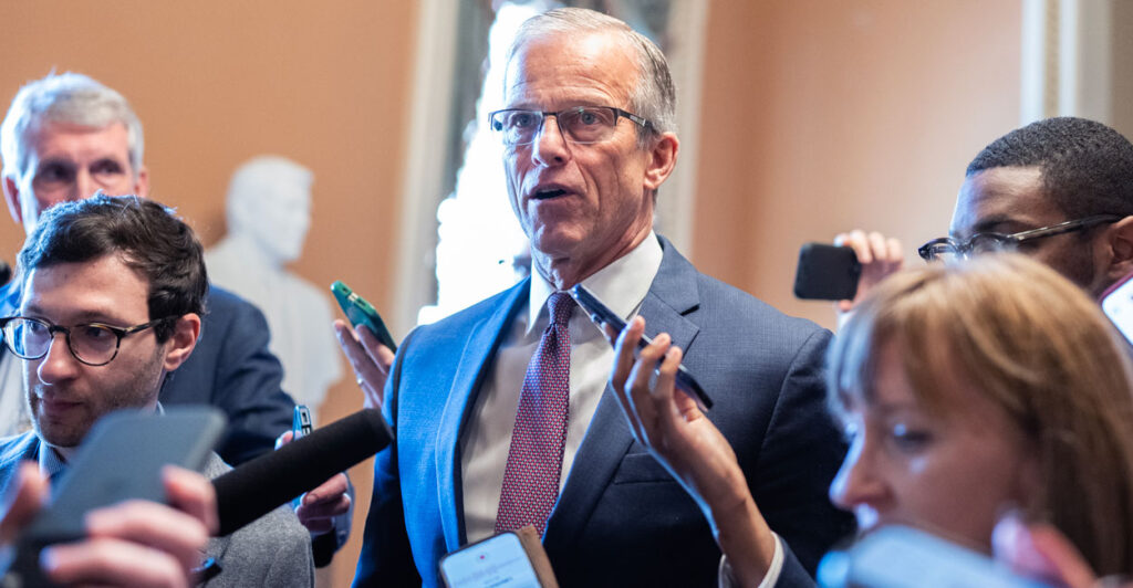 John Thune speaks to reporters