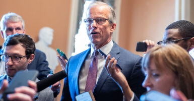 John Thune speaks to reporters