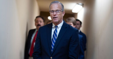 Leader John Thune stand in the capitol.